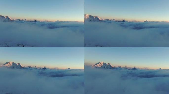 日出时Elbrus山在云海上的空中揭露镜头