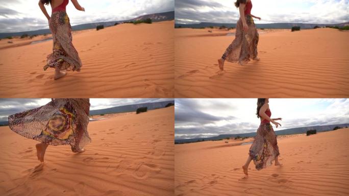 在沙丘中奔跑的女人
