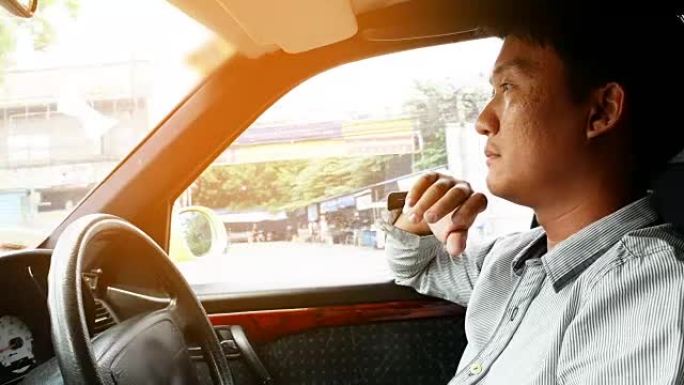 亚洲男子开车开车司机键盘