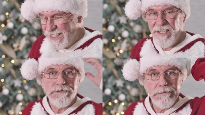 圣诞老人的脸在眼镜上的极端特写使脸不高兴，看着相机，摇头和签名。白胡子老人厌倦了圣诞节的愿望。电影院