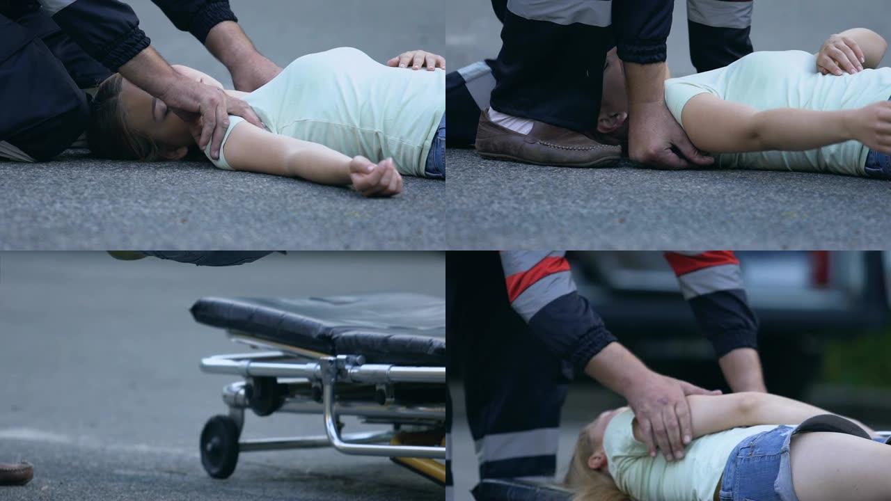 救护人员帮助事故的女性受害者，将她放在担架上