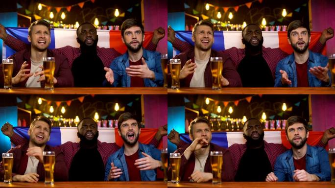 焦虑的多种族法国球迷对球队输掉比赛感到不满，坐在酒吧里