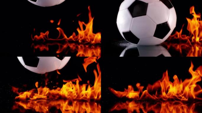 SLO MO LD足球在着火的黑色表面上弹跳