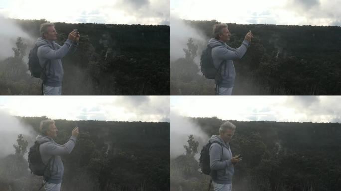 男子穿着背包走进火山景观