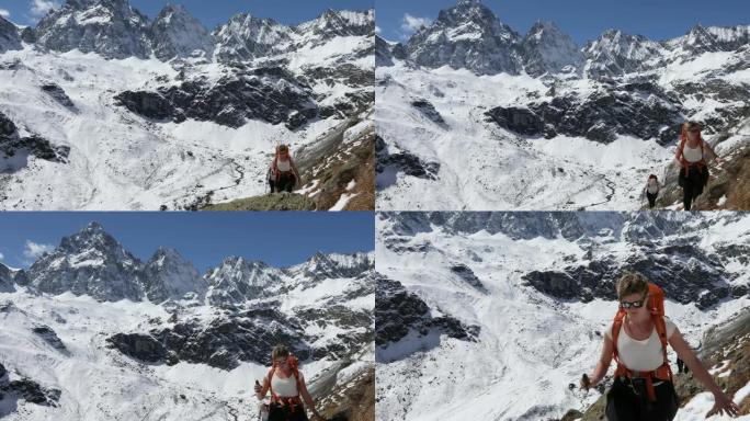 女徒步旅行者穿越雪山壁架