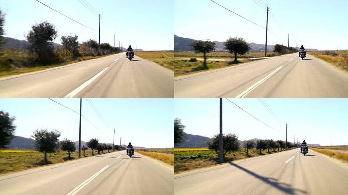 男子在乡下骑着定制的旅游摩托车