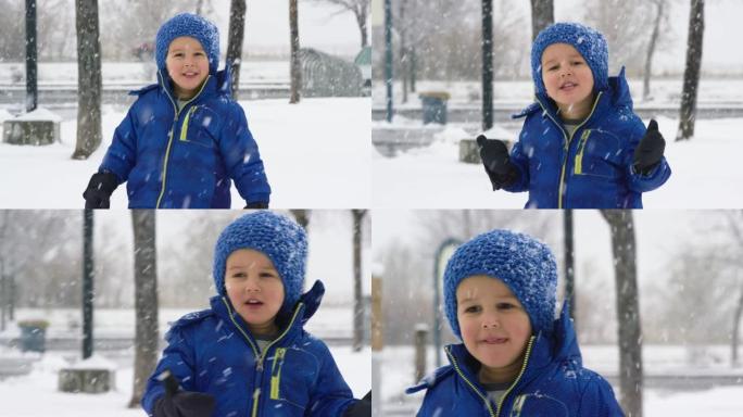 三岁的白人男孩穿着冬装走在户外，在阴天欣赏雪