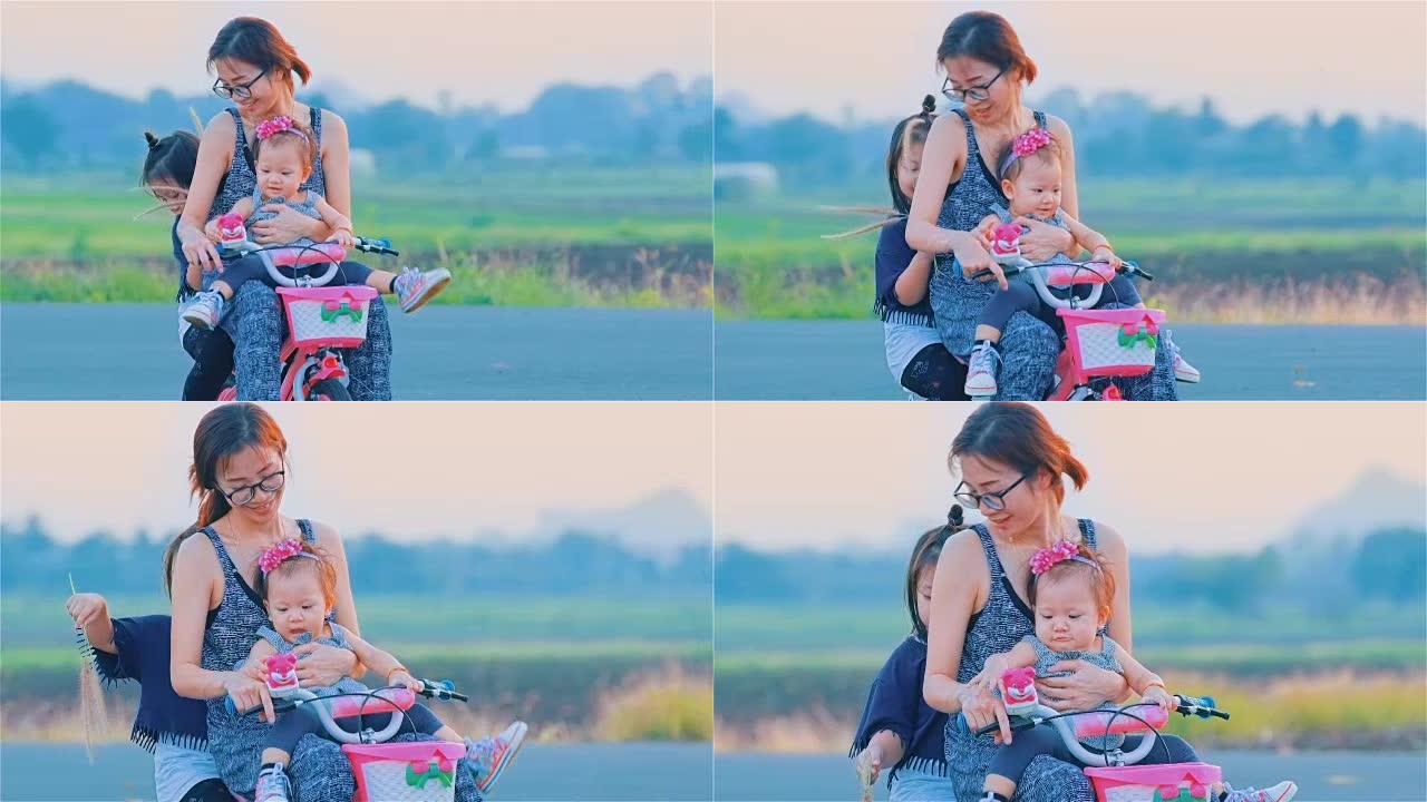 亚洲妈妈和女儿一起骑自行车