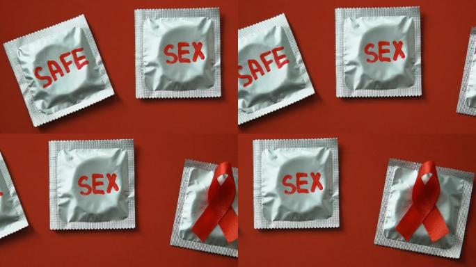 避孕套以红色的性安全字为背景，警惕艾滋病的性病概念