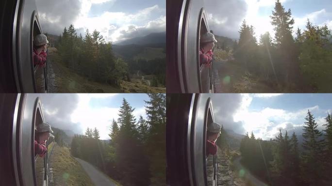 女人沿着山间铁轨坐火车，看着风景