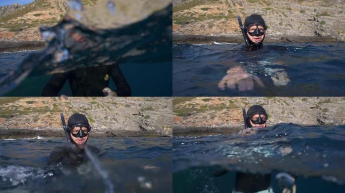 水下潜水员在海面上的慢动作拍摄