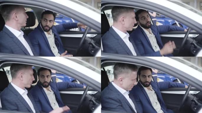 年轻自信的中东客户与高加索商人坐在车里聊天的特写镜头。成功商人在经销商购买车辆的肖像。商业，陈列室，