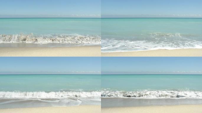 清澈的蓝色水在金色的沙滩上打磨