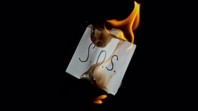 SLO MO LD白色纸，带有铭文的.O.s.在火焰中燃烧