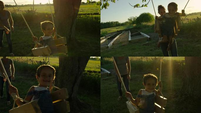 母亲在日落时推她的小男孩