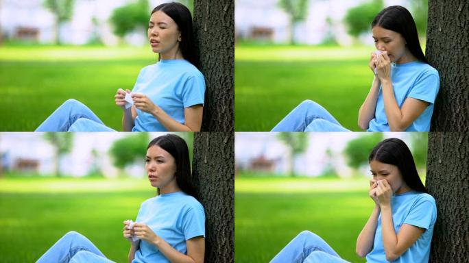 年轻女子打喷嚏组织坐树，遭受春季过敏，药物