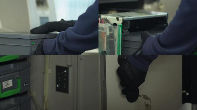 银行工人用现金箱装载自动柜员机存储的手
