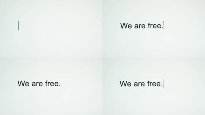 一个人在他们的电脑屏幕上输入 “我们是自由的”