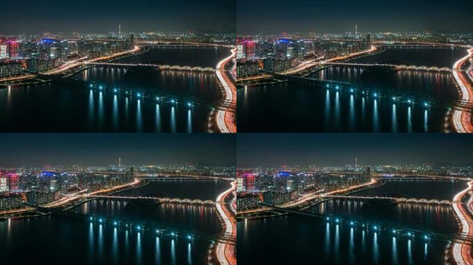 Yeouido商业区的延时夜景，桥上的汽车穿越汉江进入韩国首尔市的乐天世界塔