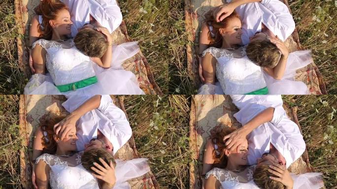 年轻优雅的夫妇在球场上拥抱。