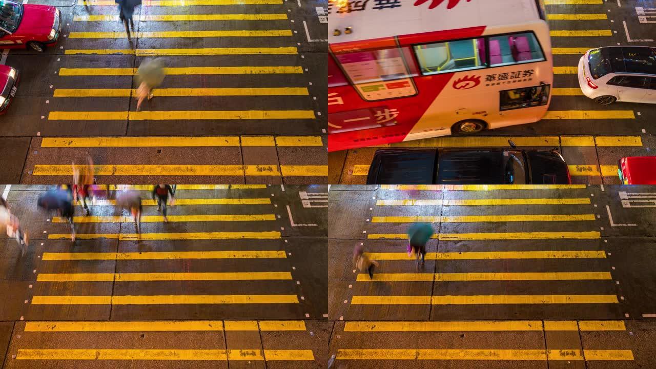 中国香港旺角区一个非常繁忙的十字路口的时间流逝的人和出租车