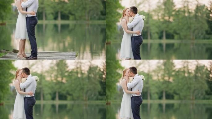 土族新娘和新郎在湖边接吻