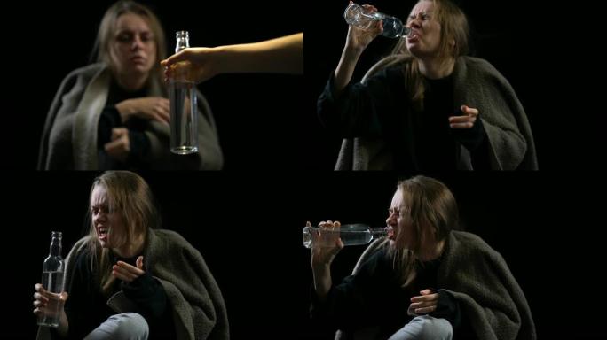 酗酒的女性贪婪地从瓶子里喝伏特加，悲惨的生活，厌恶