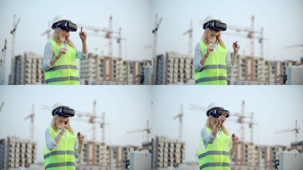 一位女检查员使用虚拟现实眼镜分析建筑商工作的肖像。一名戴着头盔和防护背心的妇女站在VR眼镜中并移动双
