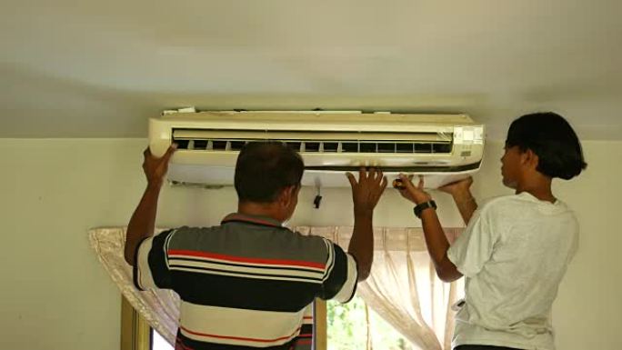 工人修理空调外国人特写实拍