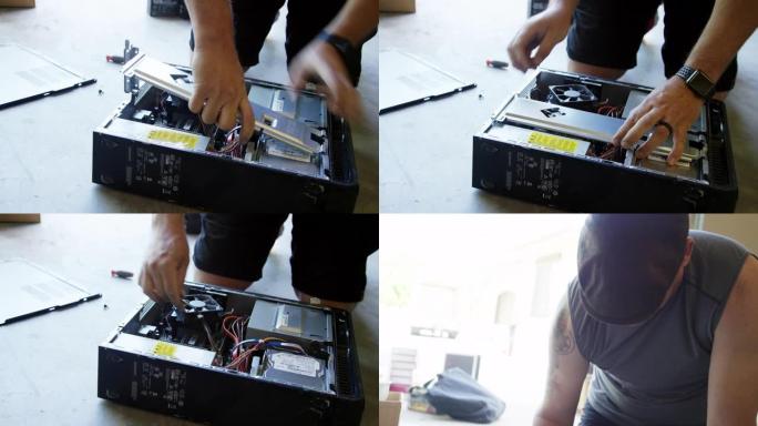 四十多岁的高加索人从车库地板上的计算机背面卸下硬件
