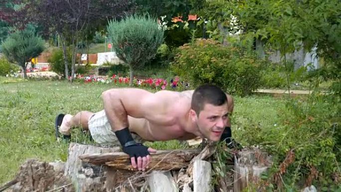 年轻人运动员做俯卧撑街头健身运动和锻炼程序