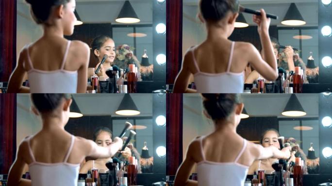 后视图: 芭蕾舞女演员在镜子前画脸
