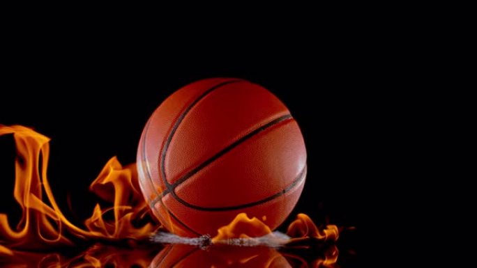 SLO MO LD篮球从黑色表面弹起时会点燃火焰