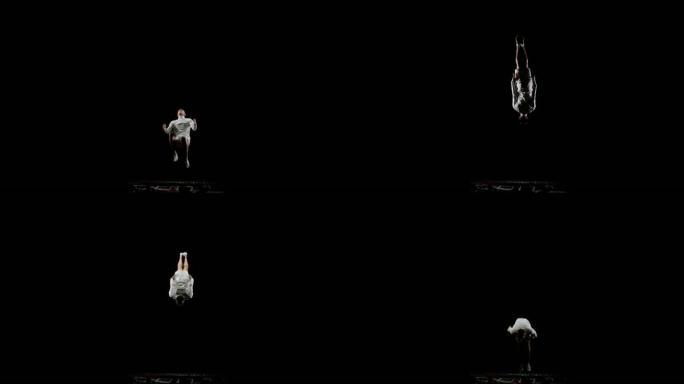 穿着白色衣服的运动员在黑色单声道背景下在蹦床上跳跃表演技巧
