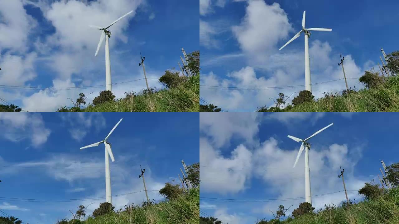 蓝天下的风力涡轮机。