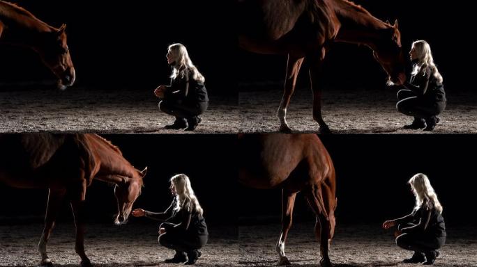 SLO MO女人晚上在谷仓里叫她的马