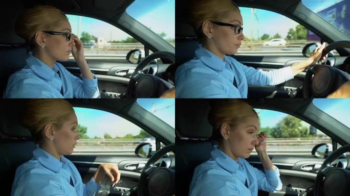 女人开车时戴眼镜，视力模糊，有发生车祸的危险