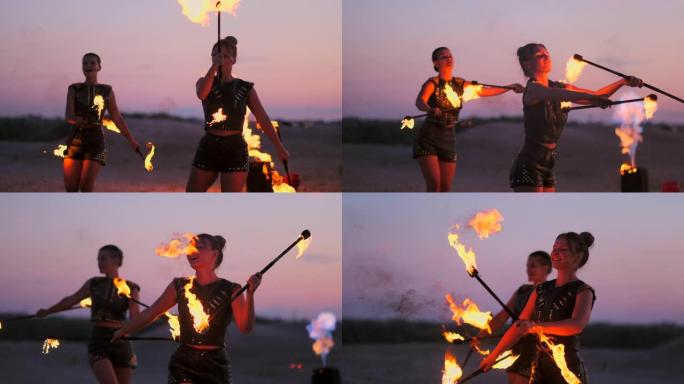 一群专业的马戏团表演者用火表演慢动作表演舞蹈表演，使用喷火器和旋转火炬燃烧的物体。