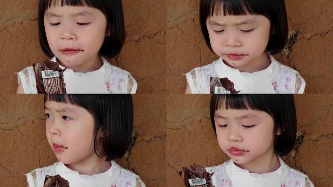 可爱的小女孩 (4-5岁) 吃巧克力冰淇淋