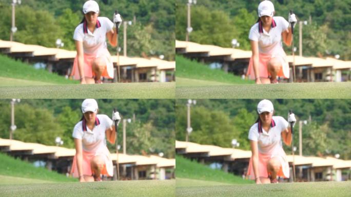 女高尔夫球手将球放在果岭上的慢动作镜头