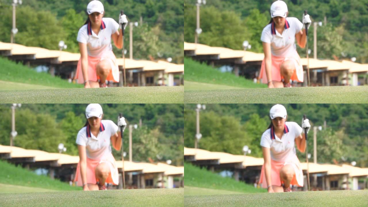 女高尔夫球手将球放在果岭上的慢动作镜头