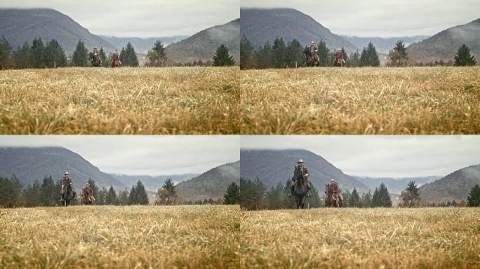 两名骑在山地草地上的骑马者