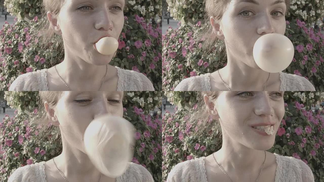 年轻女子用口香糖制造一个大泡沫