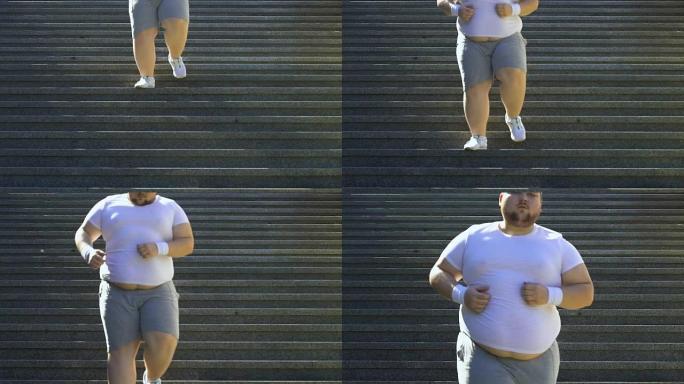 超重男性在楼梯上跑下来，试图减肥，动力