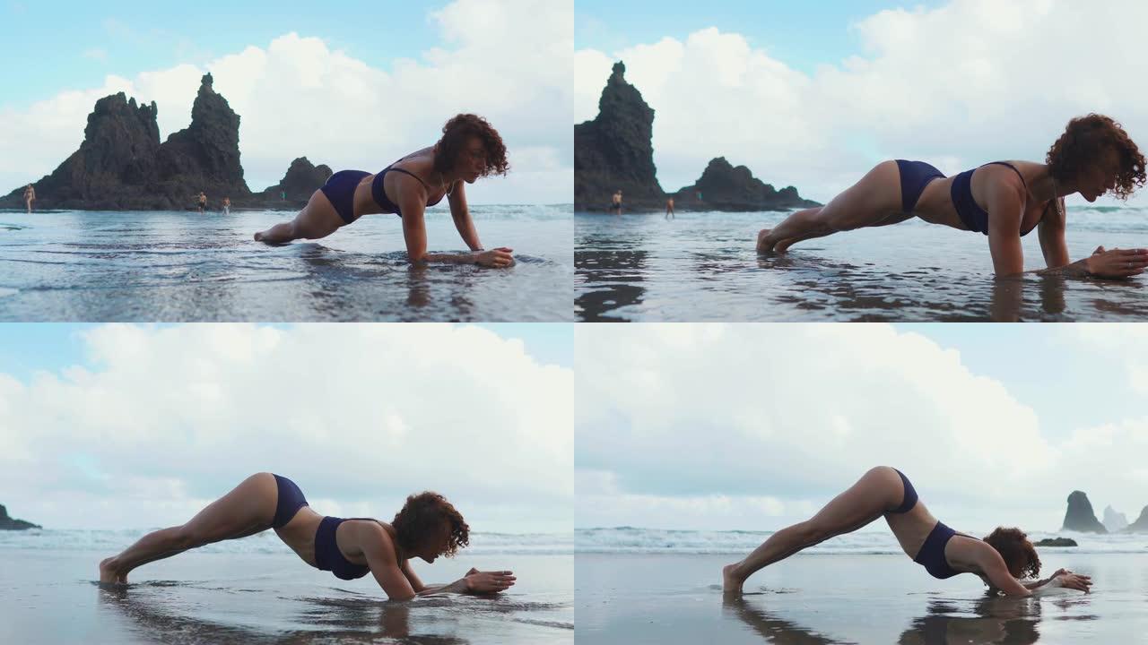 健身女性力量训练做经典传统肘板又称前臂板。女孩训练身体核心肌肉和腹肌。运动员在海滩上进行户外训练