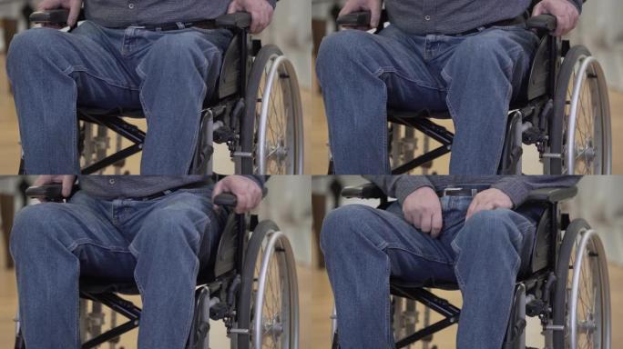 面目全非的白人老人试图从轮椅上站起来。双腿瘫痪的绝望残疾男性退休人员。