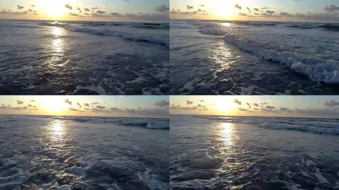 帕德里岛上的天堂，随着太阳从地平线上升起，慢动作波浪冲向岸上