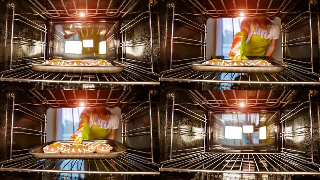 在烤箱里烤姜饼人，从烤箱内部看。在烤箱里做饭。