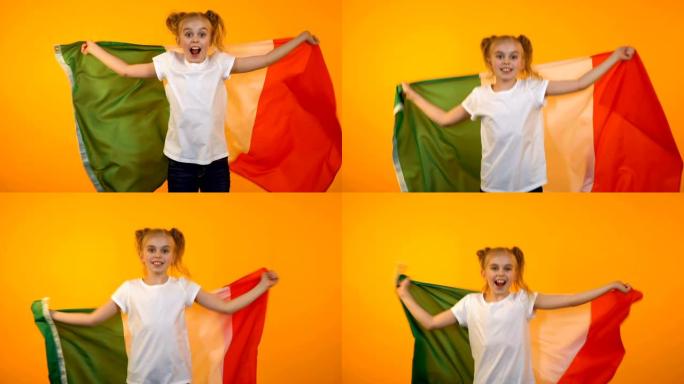 快乐的漂亮少女跳着意大利国旗，球迷欢呼