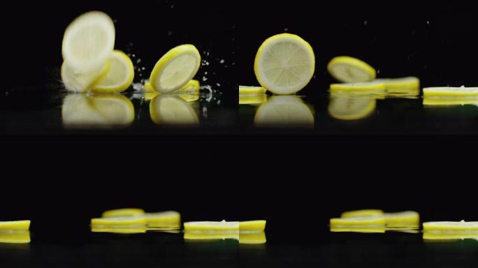 多汁的品片落在桌子上，反射和喷雾。黄色成熟柠檬环的慢动作